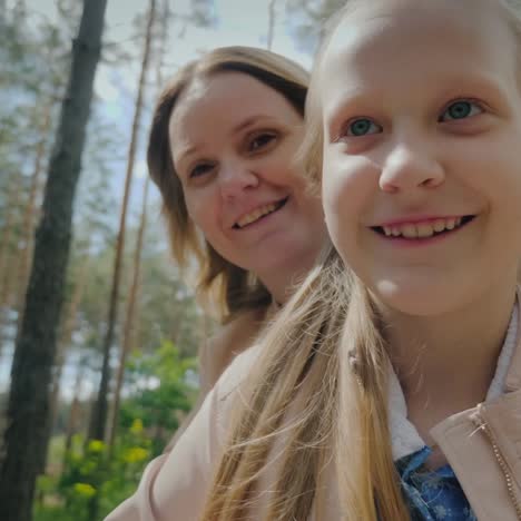 mom and daughter ride scooter together