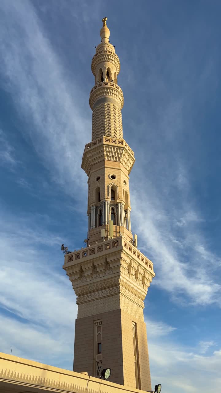 A minaret in Madinah al-Munawwarah and the clouds passing behind it