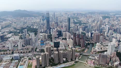 aerial view over shenzhen cityscape with massive urban development and skyscrapers