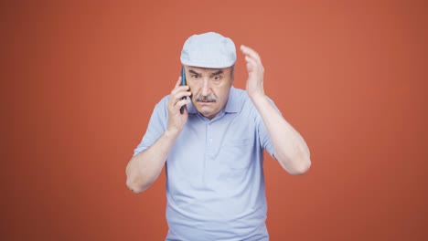 Old-man-getting-bad-news-on-the-phone-gets-upset.