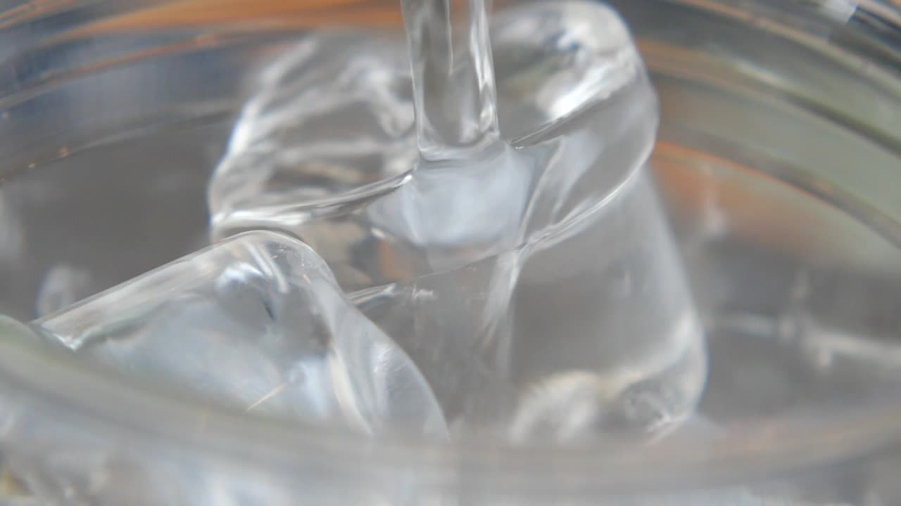 Pouring water over ice cubes