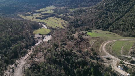 Tavertet-region-in-barcelona-showing-lush-forests-and-winding-roads,-aerial-view