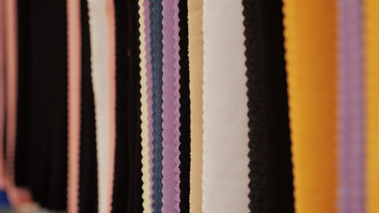 Fabric samples textile in market shop, colorful palette cloth accessories interior design, shopping choosing color tone textile in shop atelier