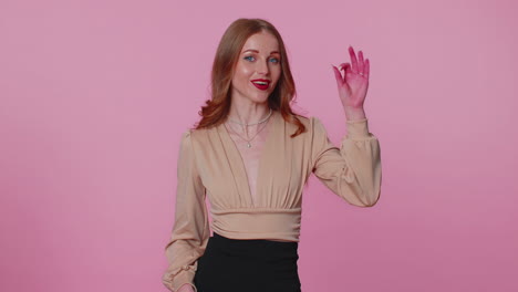 Positive-businesswoman-girl-showing-ok-gesture,-like-sign-positive-something-good-on-pink-background