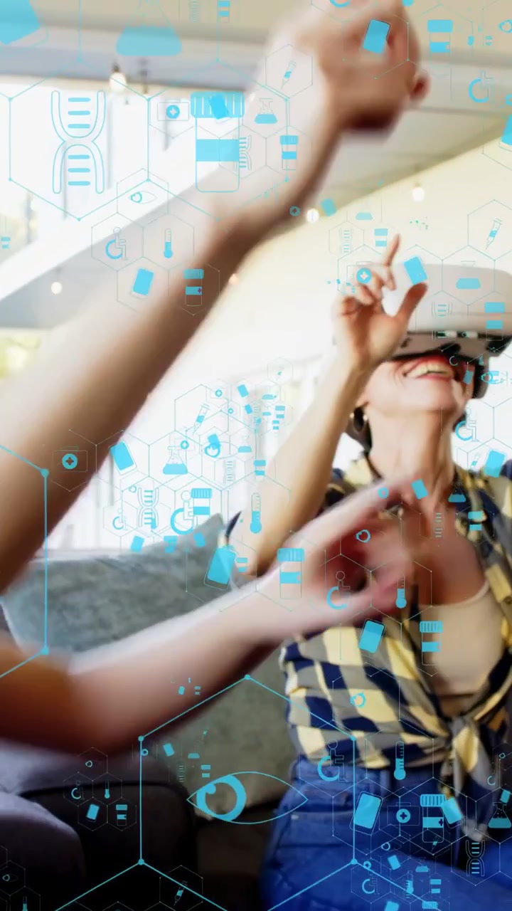 Vertical video: Woman on right lowering VR headset, pointing and tapping to explore VR gaming HUD