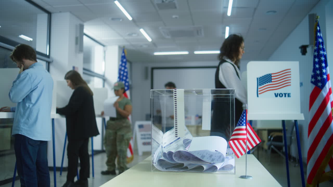 Asian Woman and African American Female Military put Voting Ballots in Box Multiethnic Voters or us Citizens Vote in Booths at Polling Station Asian Woman and African American Female Military put Ballots in Box National Election Day in the United States Democracy Concept