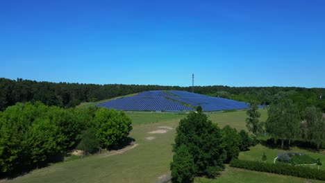 photovoltaic panels installed on a former landfill, transforming a waste site into a source of renewable energy, a solution for the future. majestic aerial view flight fly reverse drone