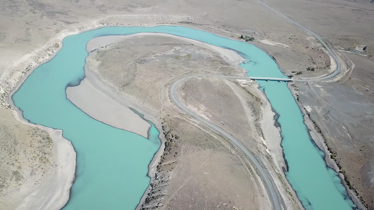 Aqua Blue Glacial River. Road and Bridge in Desert Landscape of Patagonia, Argentina. Perito Moreno Glacier Outflow