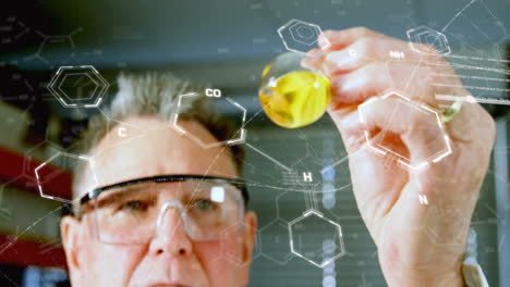 animation of dna strand and chemical formula over caucasian male scientist doing experiment