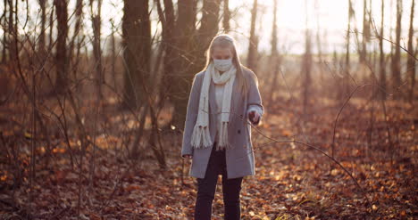 woman putting on protective mask against coronavirus 2