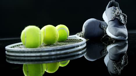 Tennis-balls,-racket-and-sports-shoe-in-studio-4k