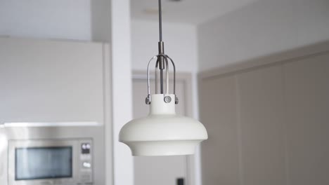 modern white pendant light in a kitchen