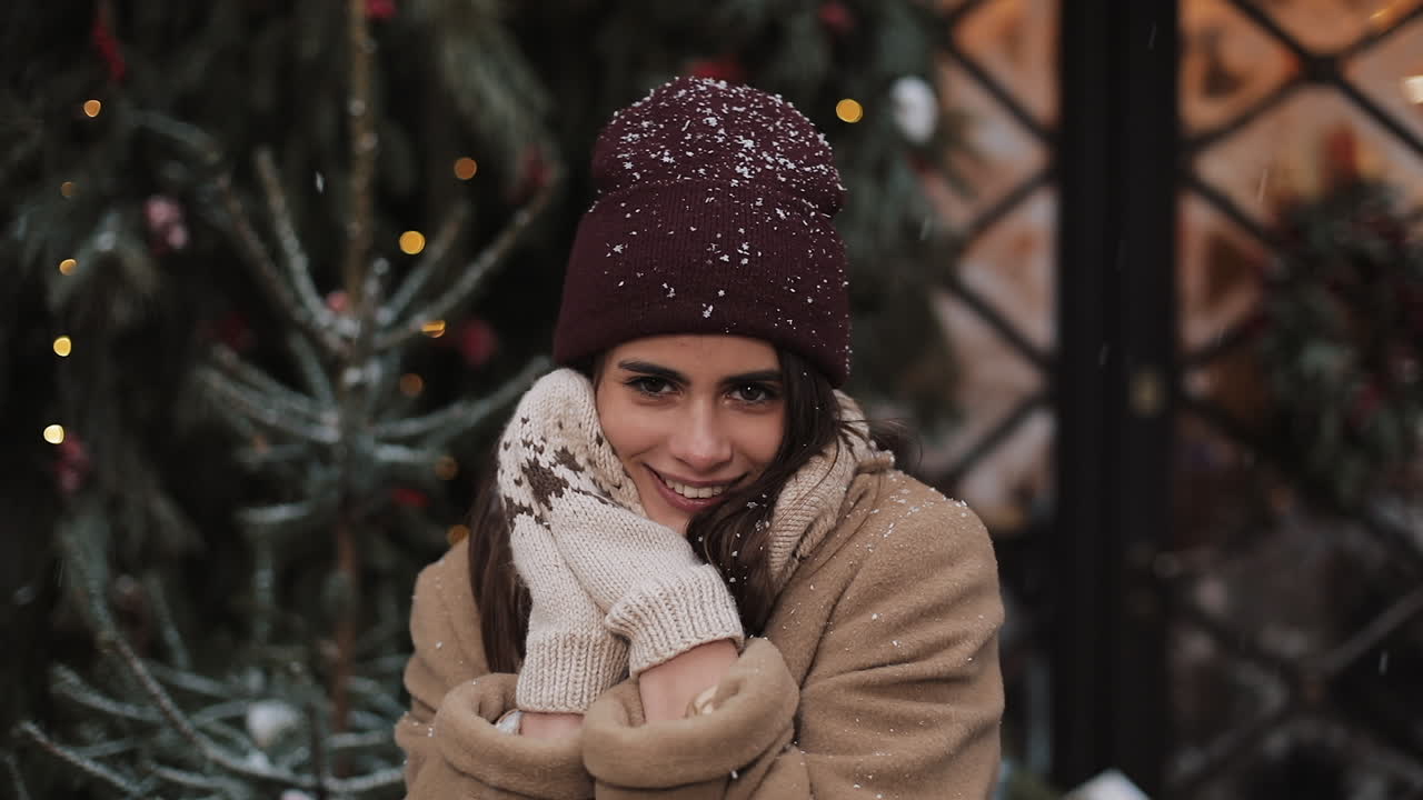 Portrait of a Smiling Woman in Winter with Snow