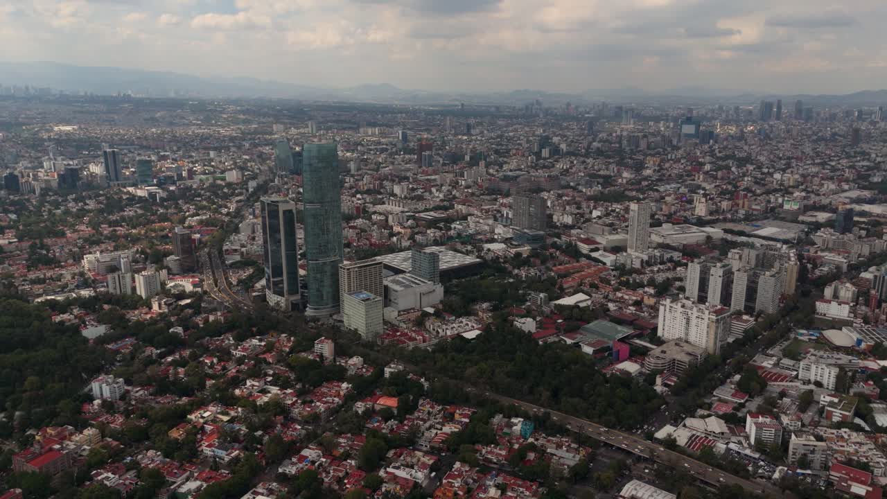 Clear day drone shot of highest building in Mexico City