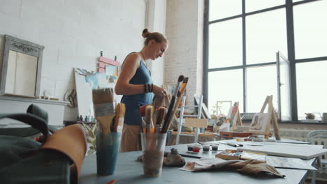 woman painting in her art studio