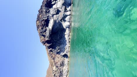 Vertical-footage,-rock-formations-on-the-shores-of-Isla-Coronado,-in-Loreto,-Baja-California-Sur,-Mexico