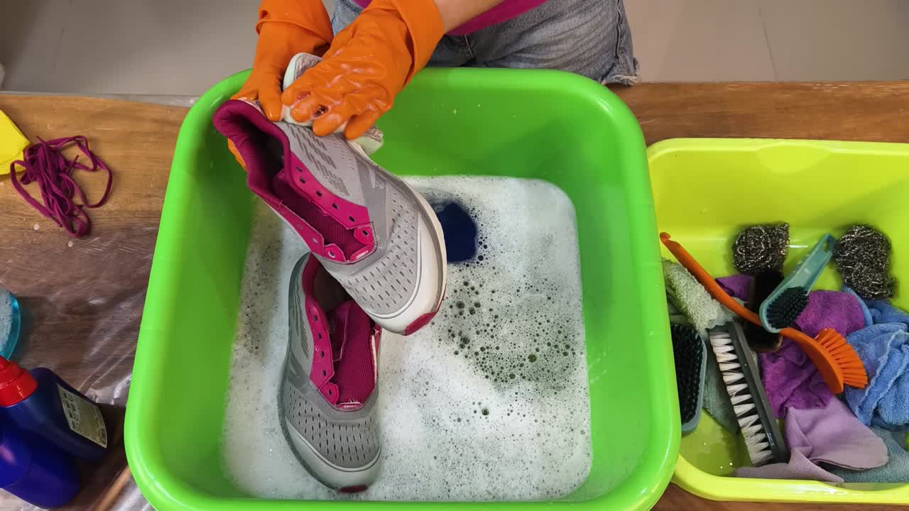 Cleaning shoes in a basin