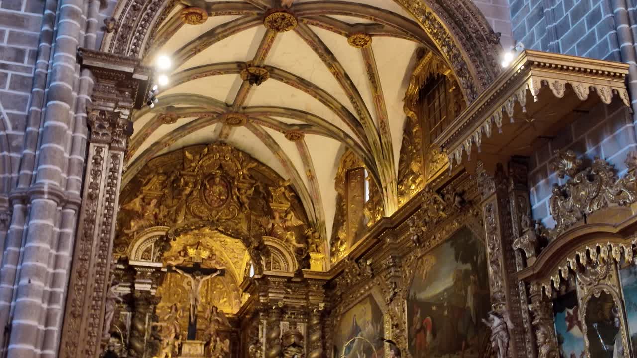 Interior detail of gilded ceiling and altar in Igreja de Sao Francisco in Evora