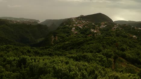 Aerial-drone-shot-over-La-palma-island,-revealing-the-clouds-over-the-ocean