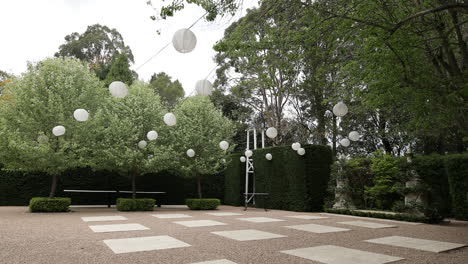 spacious outdoor area decorated with white paper lanterns