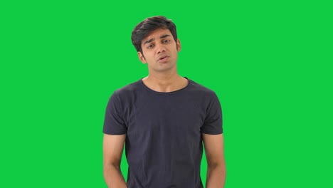 Stressed-and-depressed-Indian-boy-standing--Green-screen