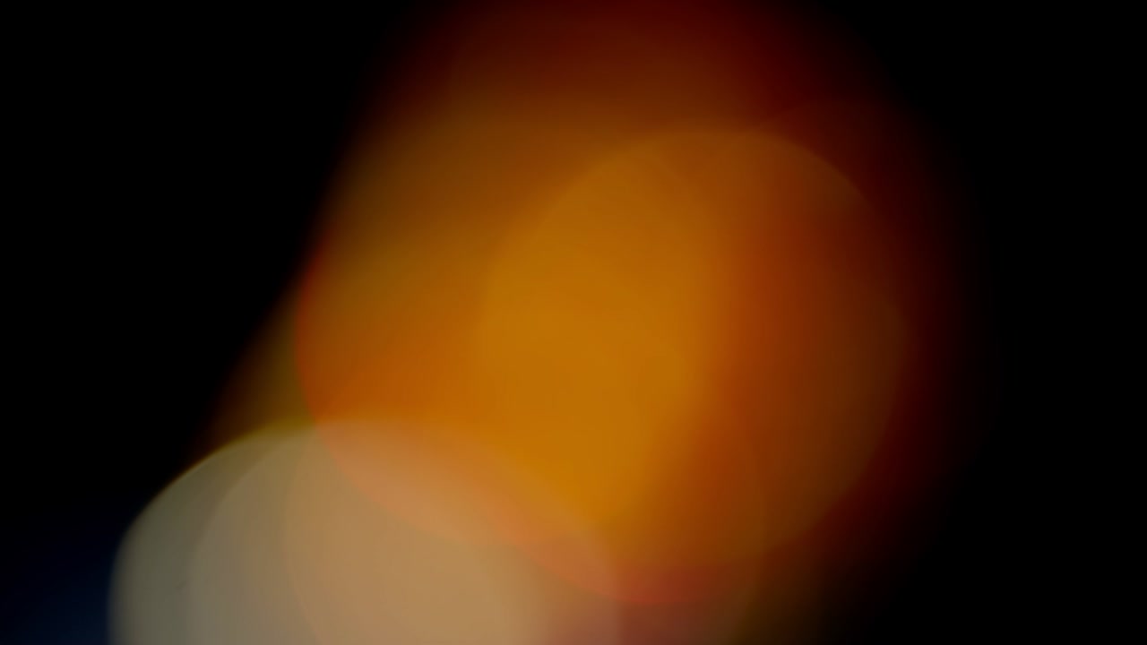 Multicolored light leaks footage on black background, lens flare leak burst overlays transitions