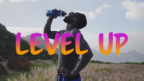 Animation-of-the-words-level-up-in-pink-and-orange-over-man-exercising-in-countryside-drinking-water