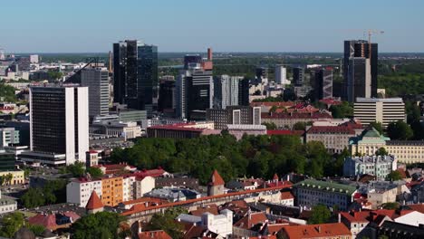 forward drone shot above maakri modern business district in tallinn, estonia