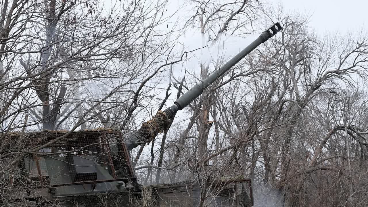 Close-up view of the smoke drifting from the muzzle of a German-made PzH 2000 howitzer in Ukraine. This shot was taken moments after the artillery fired a shell at a Russian military position