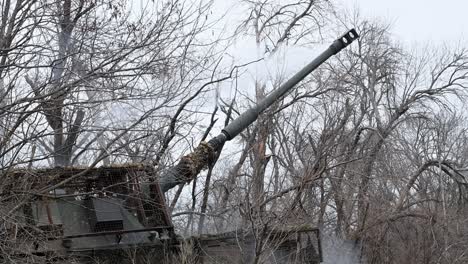 close-up view of the smoke drifting from the muzzle of a german-made pzh 2000 howitzer in ukraine. this shot was taken moments after the artillery fired a shell at a russian military position