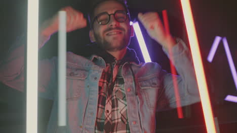 man celebrating with neon lights