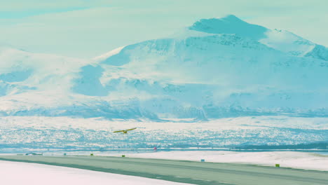cinematic shot of a light aircraft taking off from tromso airport