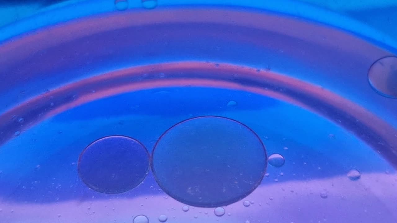 Colorful abstract background of oil and water creating a psychedelic pattern in macro