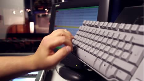 dj hands working on a audiomixer at studio close up