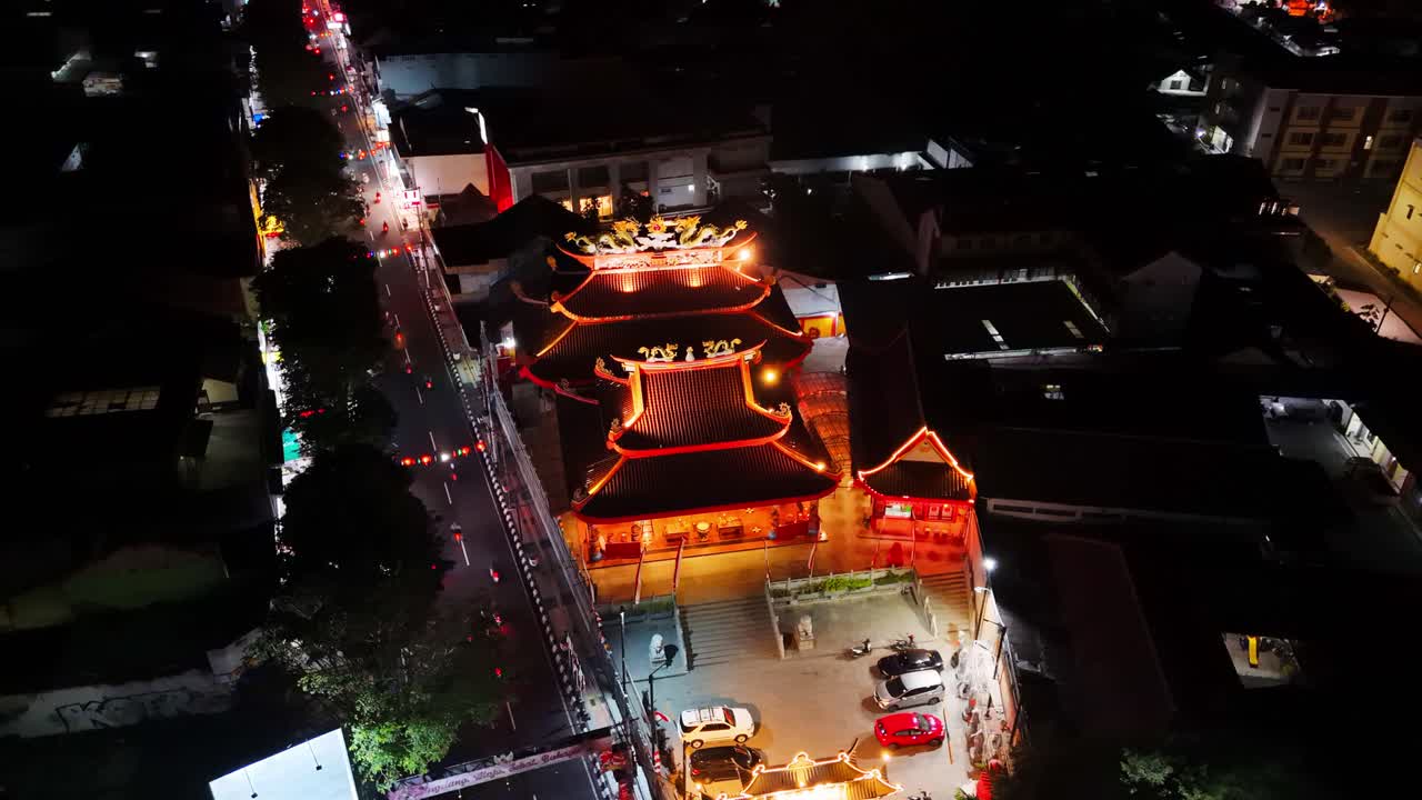 Aerial view of temple Liong Hok Bio on the night. Iconic building on the Magelang Town Square. 4K night drone shot.
