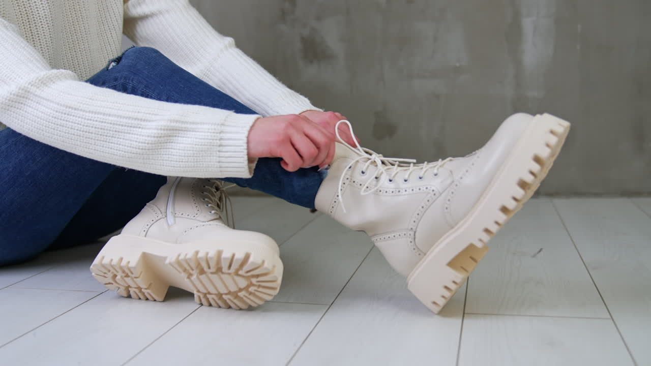 Woman Tying Lace-Up Beige Platform Boots