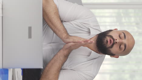 vertical video of home office worker man working with concentration.