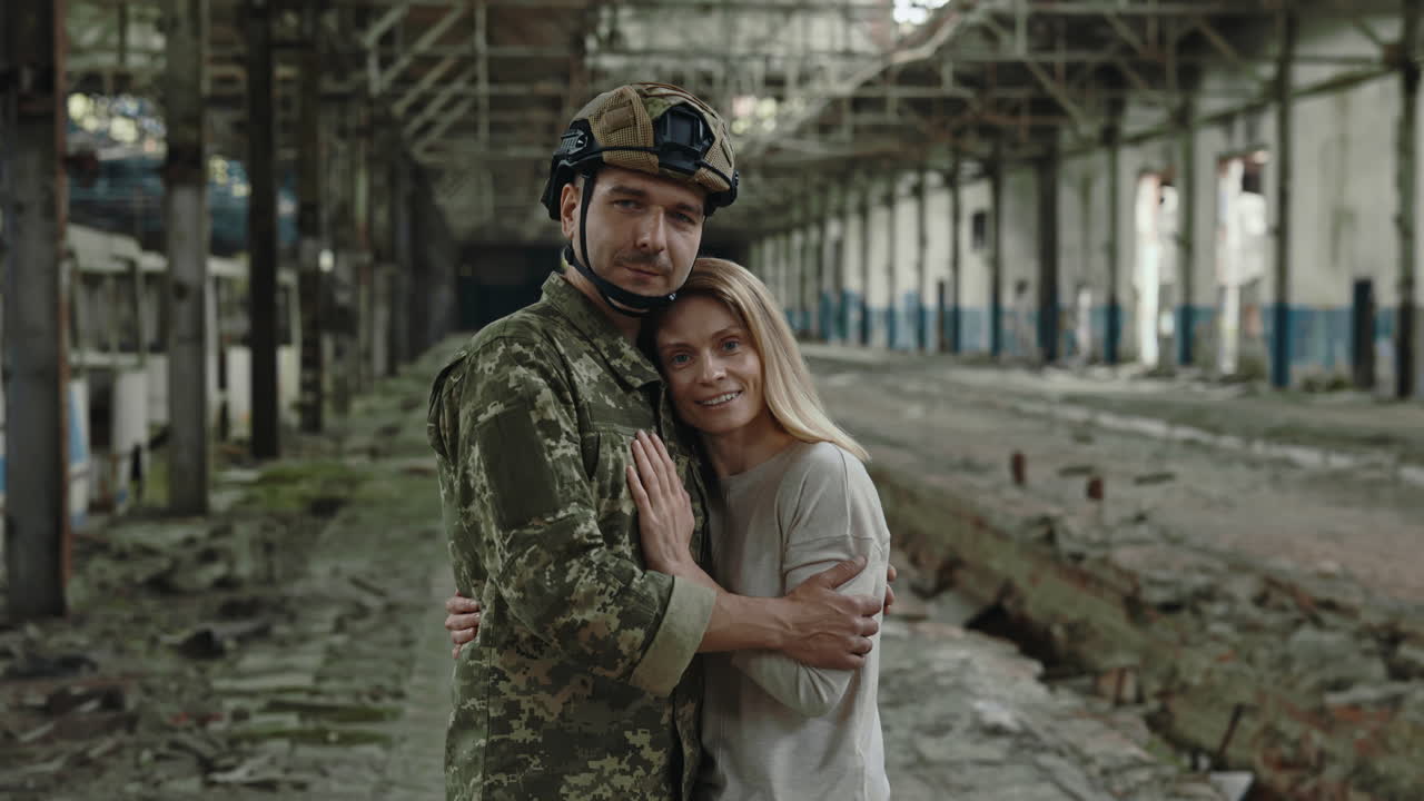 Soldier and his Wife in a Destroyed Factory