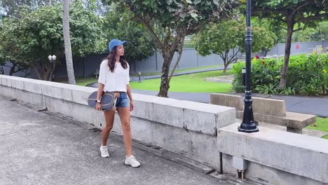 woman skateboarding in a park