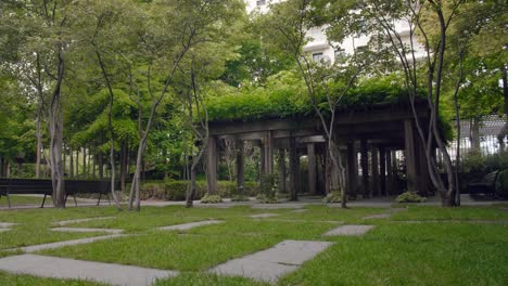 steady shot of 5 continents park jacques chirac with vegetated green monument and benches in levallois, france