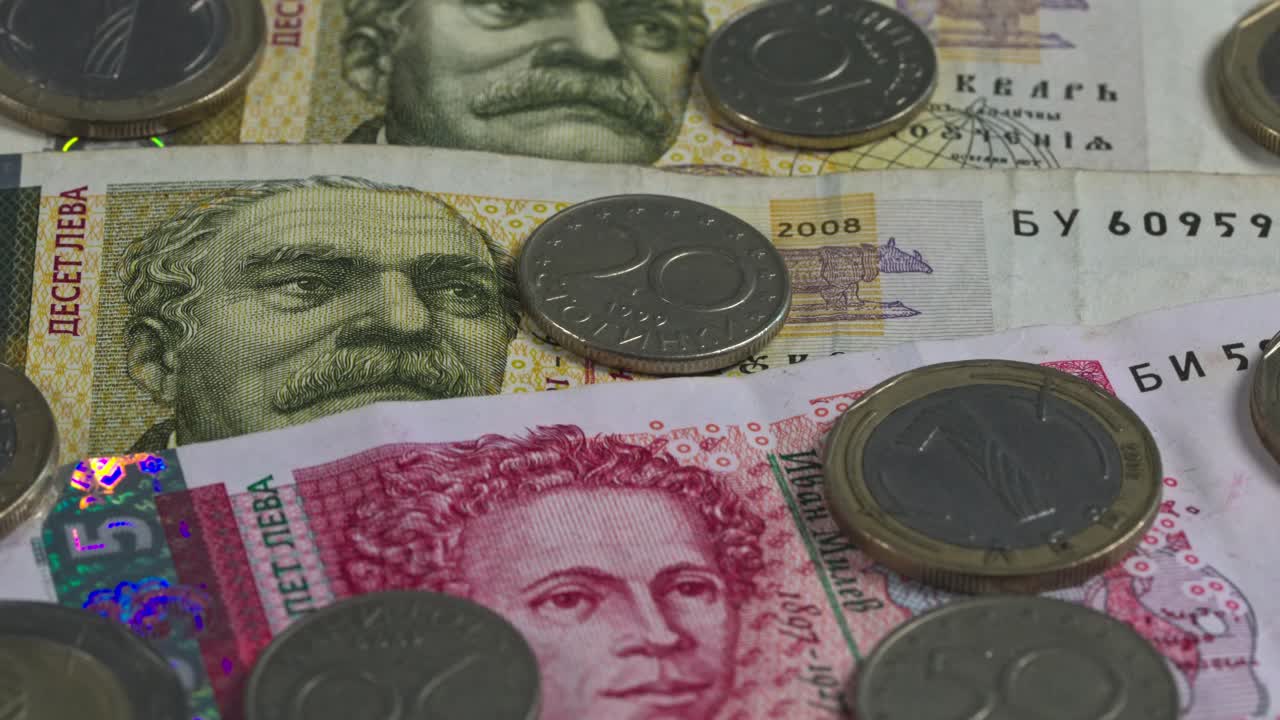 Currency and coins displayed on a table in a simple arrangement