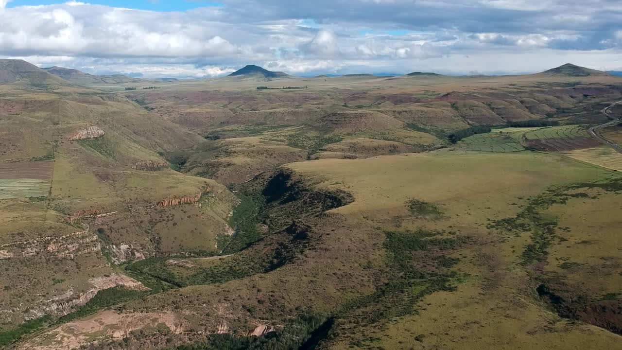 Drone shot of green mountain and valley range