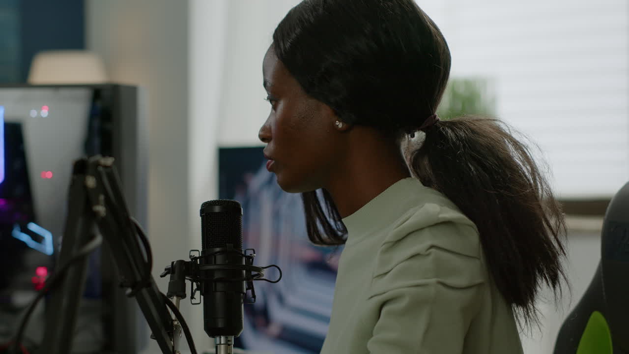 Professional online live black streamer gamer looking at camera