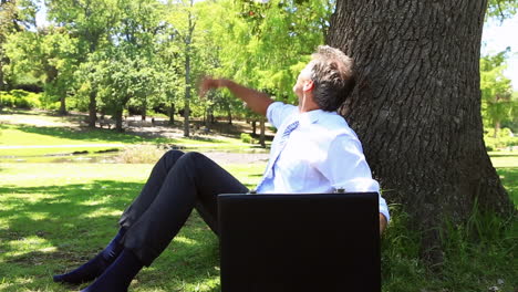 stressed businessman throwing away his papers