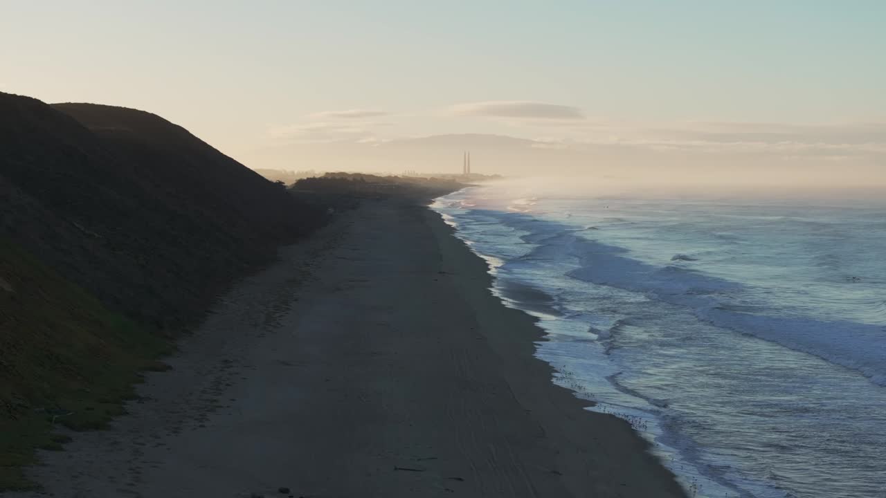 Manresa Sunset State Beach sunrise early morning must fog Moss Landing Powerplant Pajaro Dunes California aerial drone Santa Cruz surfer waves sand Twin Towers Monterey Bay Pacific Ocean forward up
