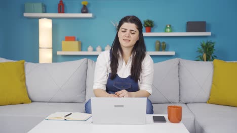 Woman-looking-at-laptop-is-happy-and-dancing.