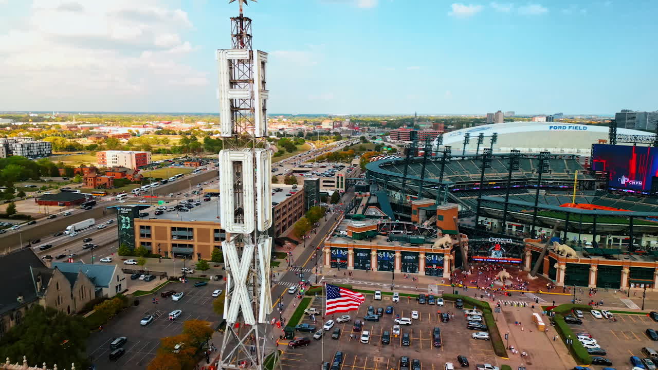 Detroit, USA, 28 July 2025: Detroit ballpark and giant rooftop sign. Aerial view of Comerica Park, rooftop DODX sign tower and American flag waving over Detroit
