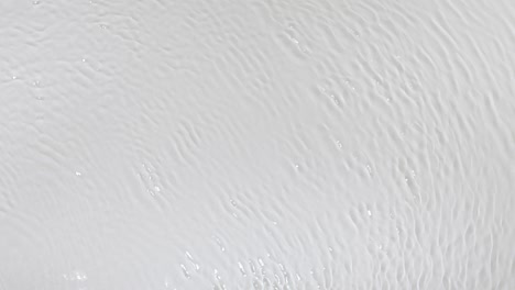 water surface texture rippled by wind. ripples and waves. clean water textured background, top view