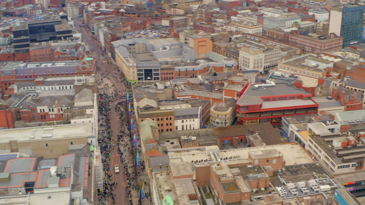 Aerial pan of Belfast city during the St Patricks parade