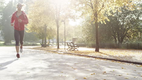 runner woman running in park exercising outdoors